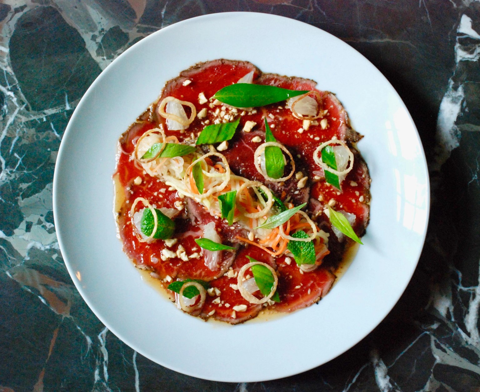 Beef tataki, herbs, peanuts and crisp shallot