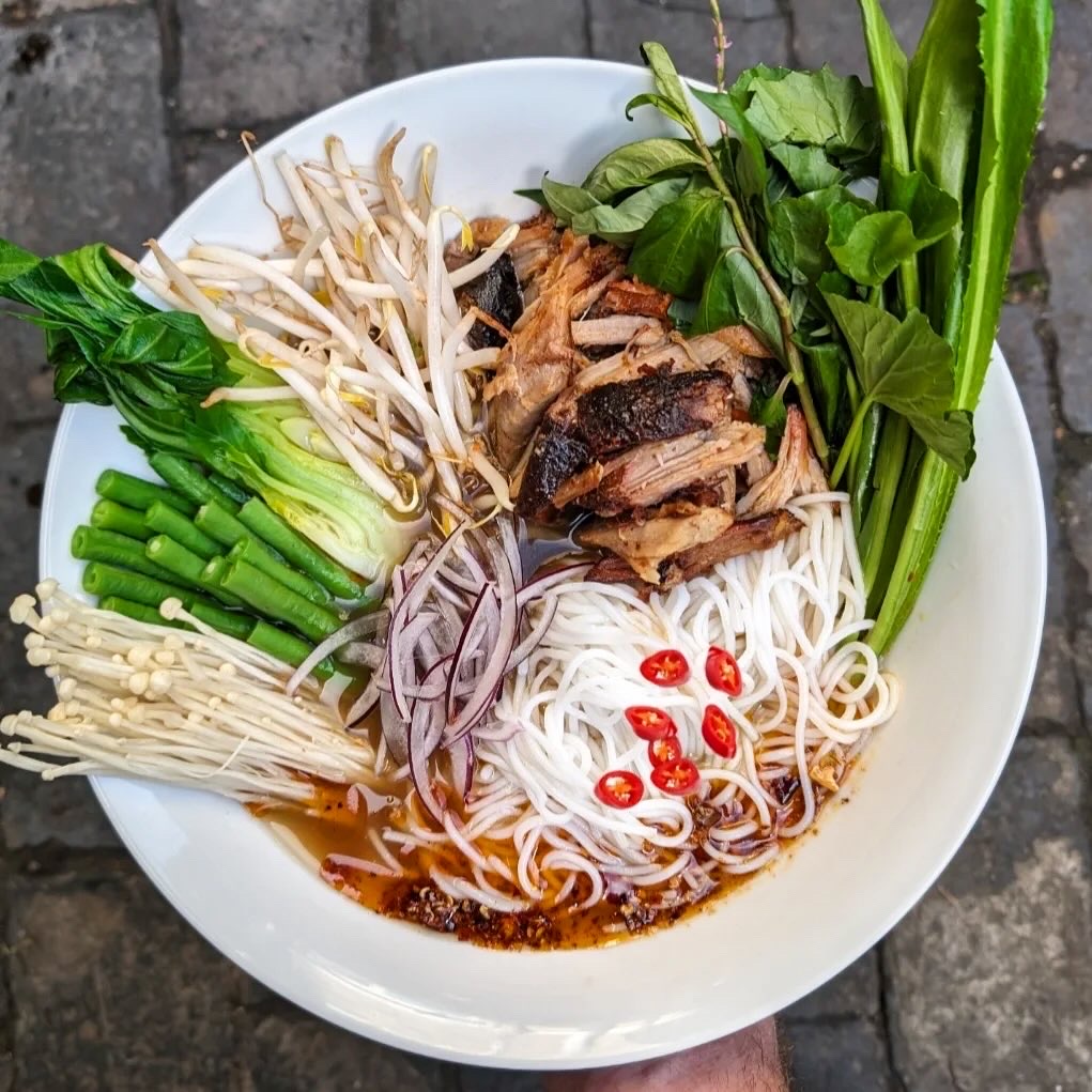 Roast duck noodles with greens and chilli