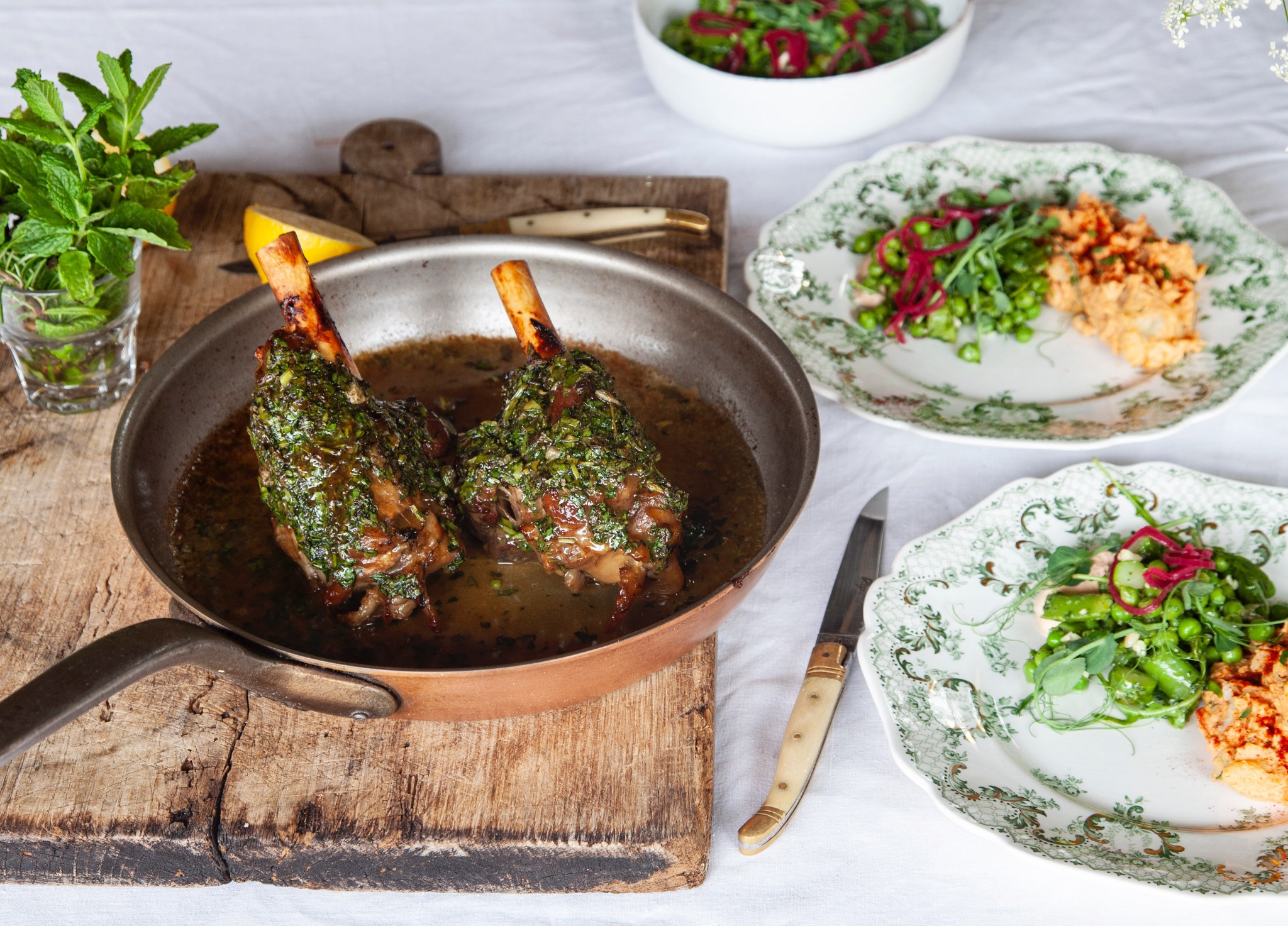 Herb-roasted lamb shanks with spring vegetables