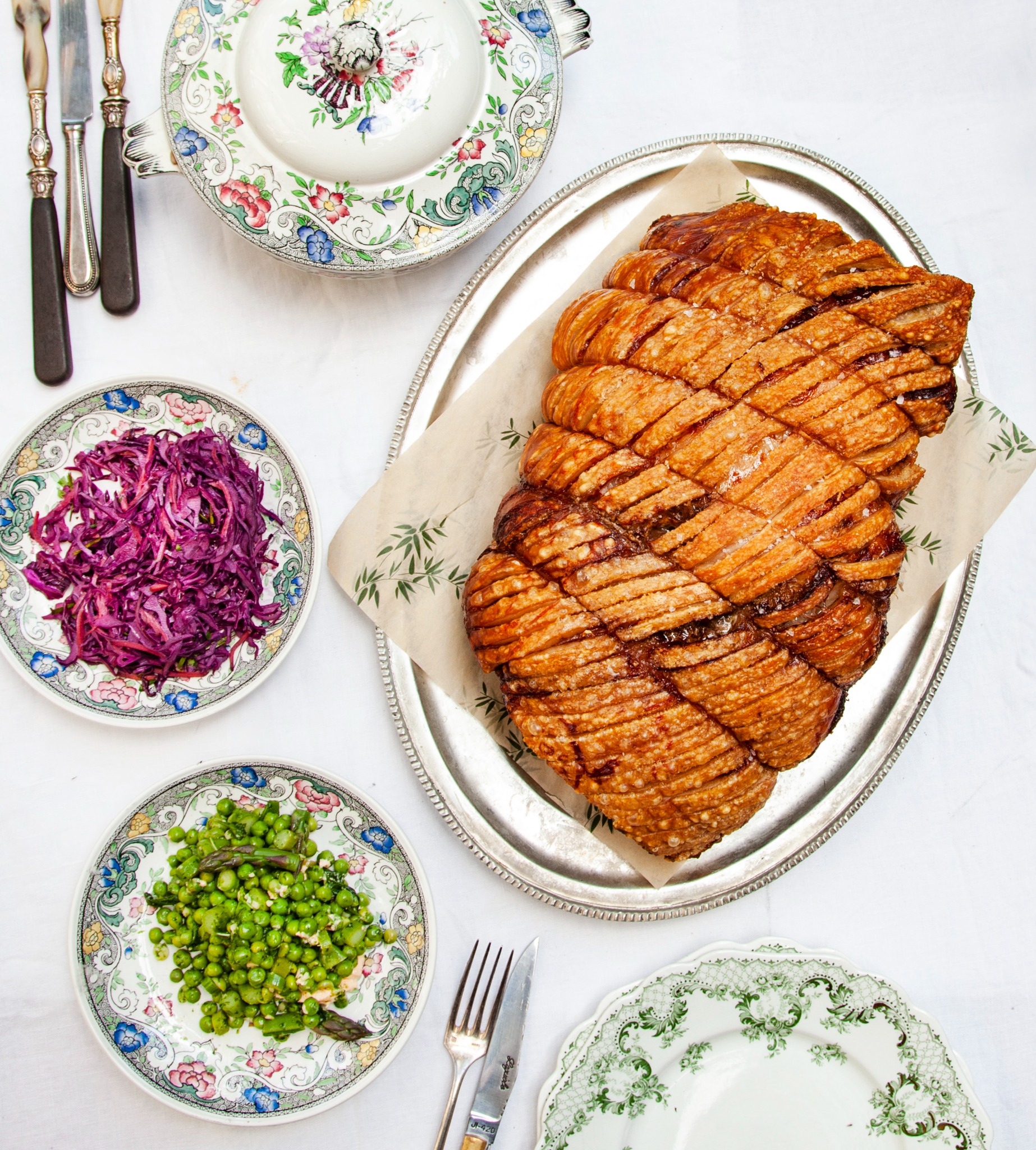Porchetta with spring peas and red cabbage