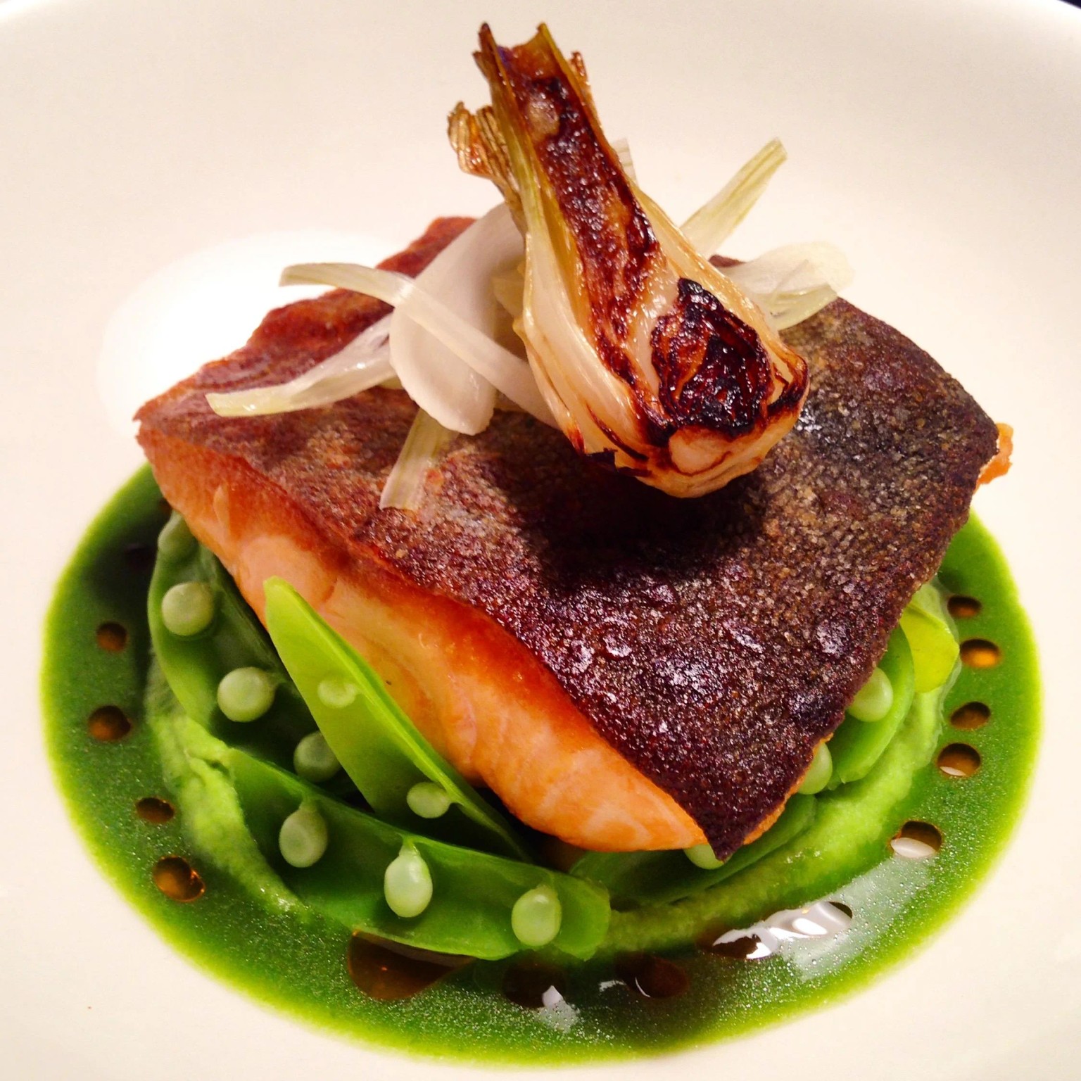 Crisp-skinned salmon, peas and roasted fennel