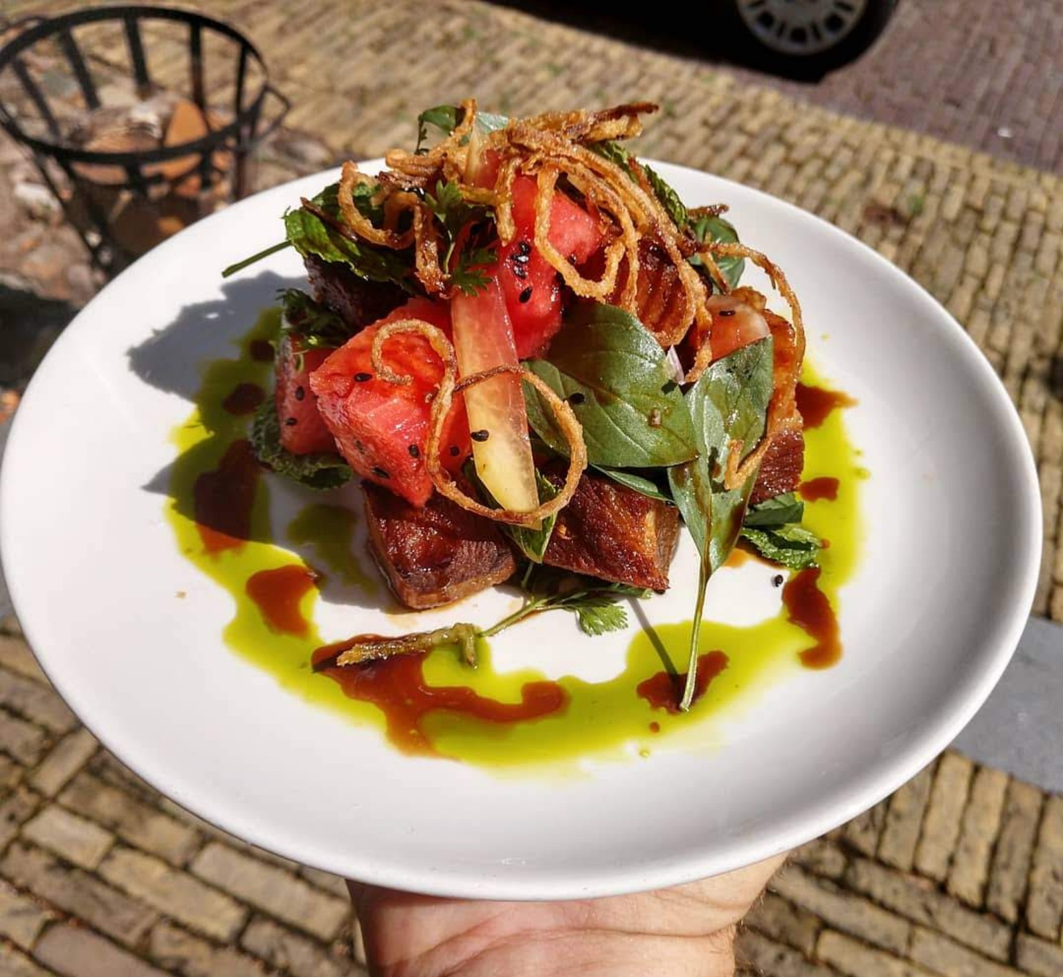 Tomatoes and herbs piled on grilled bread